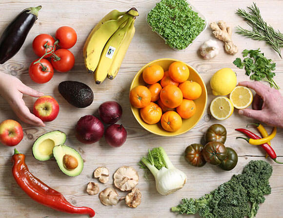 A photograph of and organic fruit and veg from above