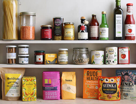 A photograph of the inside of a pantry cupboard, full of foodstuffs