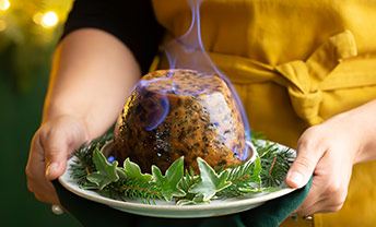 Dig a spoon into handmade Christmas dessert or pudding