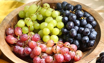 Enjoy the return of organic white and black grapes
